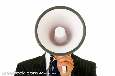 Portrait of a man talking into a megaphone Portrait of a man talking into a megaphone